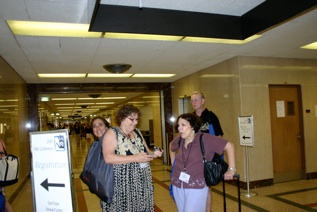 Saul Bell finalist Sherry Cordova peaks out from behind Kathleen Gordon, with Susan and Bob